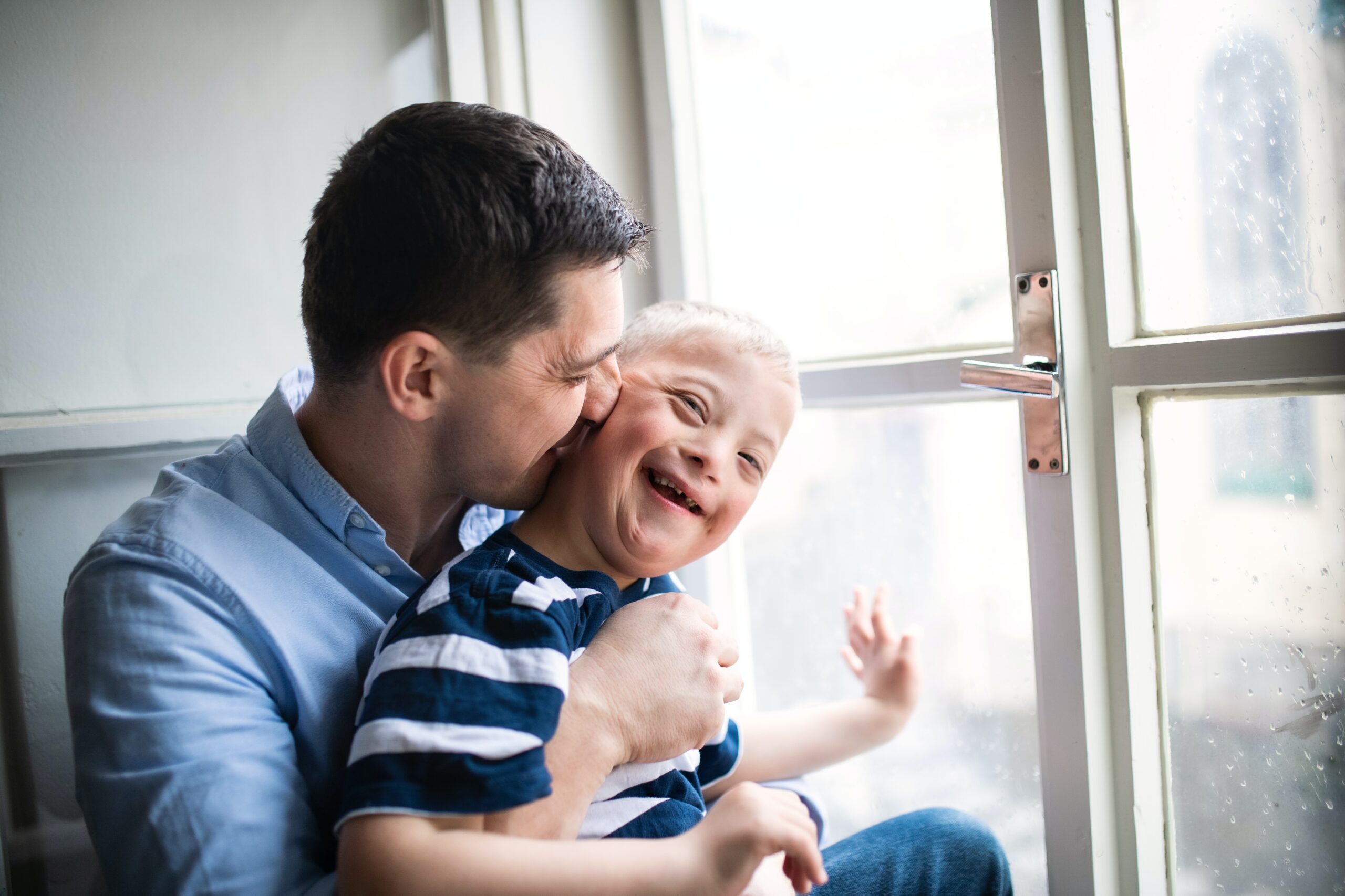 neodivergent child with his father